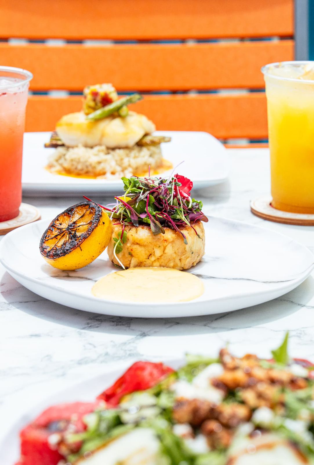 Crab cake and tropical drinks on the patio